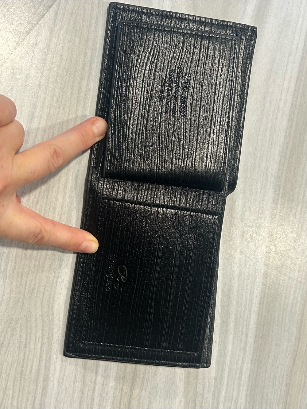 Men's Black Leather Bi-Fold Wallet with Embossed Face and Yellow Eye Accent - Picture 2 of 14